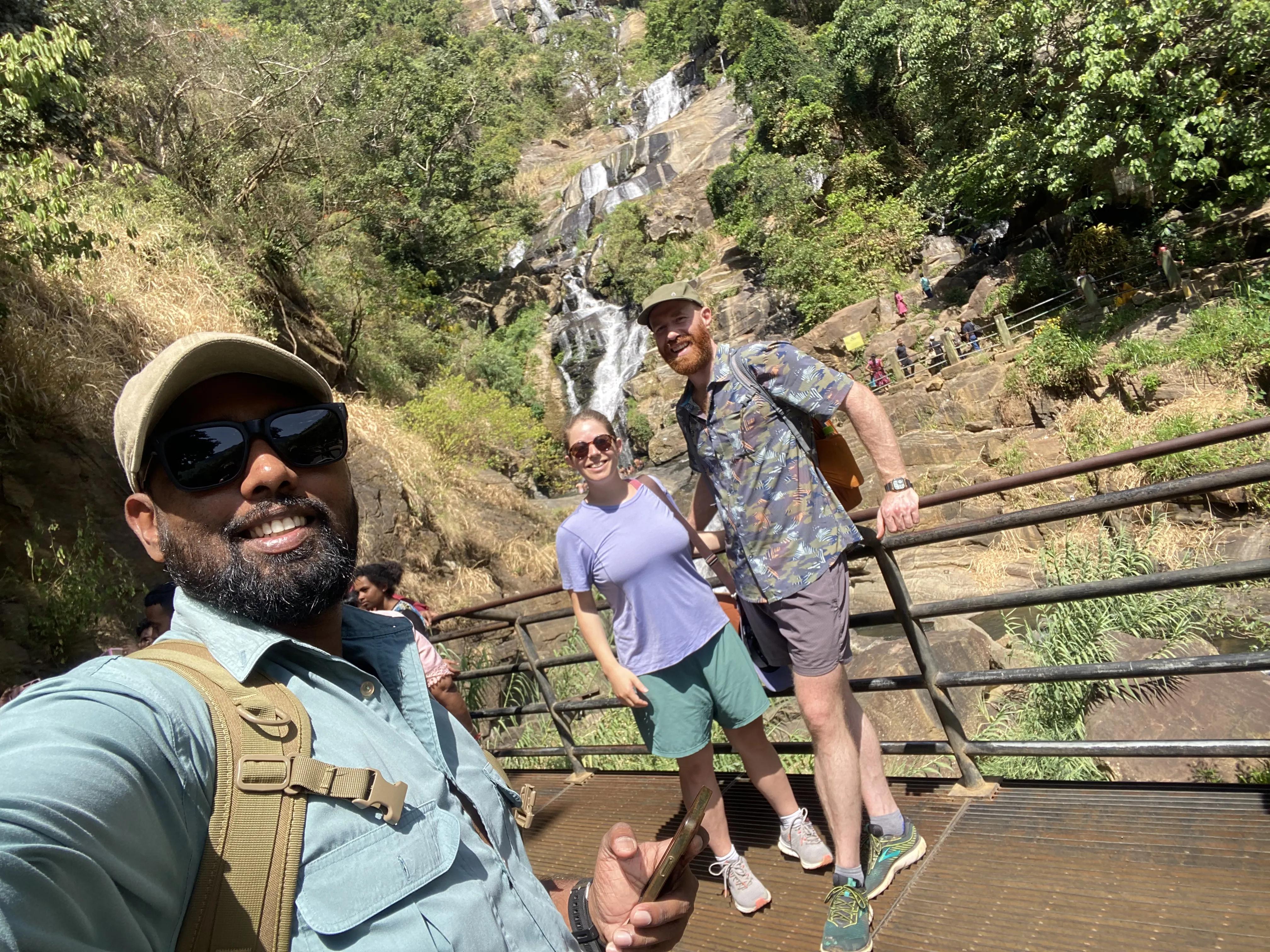 Thiwanka Rathnasekara guiding guests at a Sri Lankan waterfall