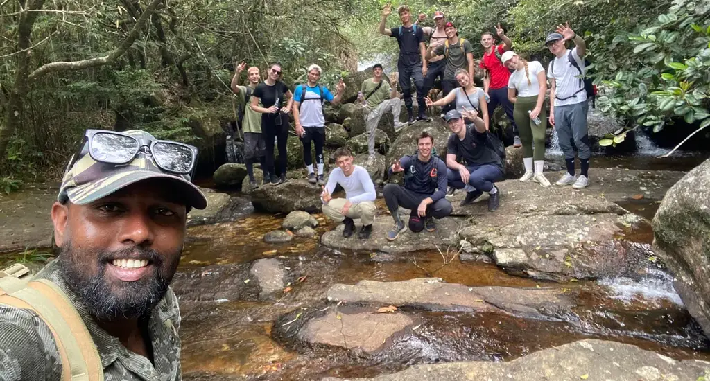 Local guide Thiwanka Rathnasekara with international travellers on a wildlife safari