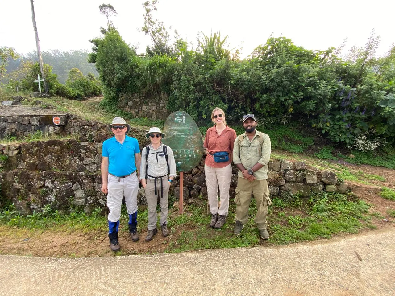 Thiwanka guiding guests on a nature trekking tour along Sri Lanka's Pekoe Trail through lush tea country