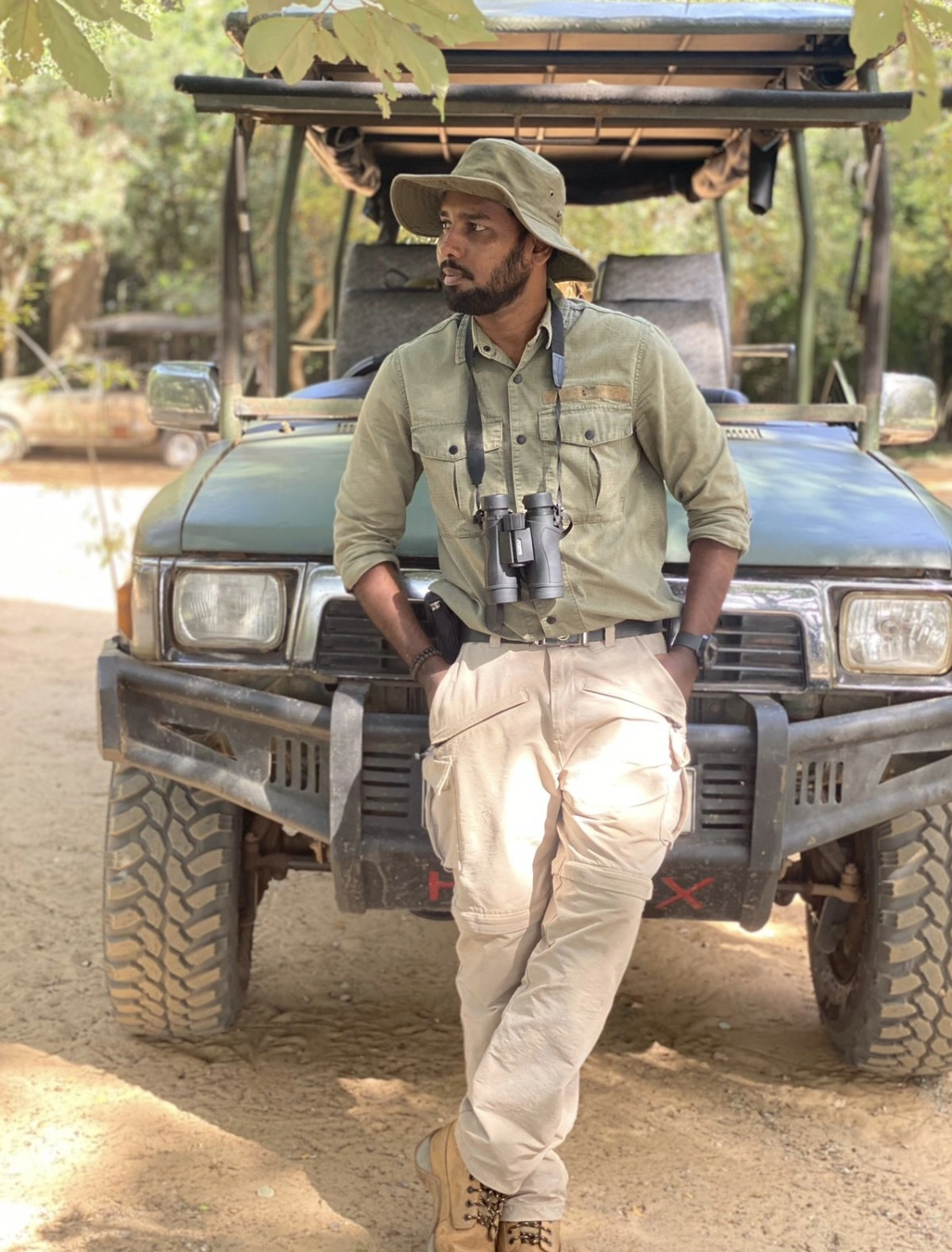 Thiwanka Rathnasekara, certified Sri Lanka wildlife and nature tour guide with 7+ years experience, leading guests through national parks